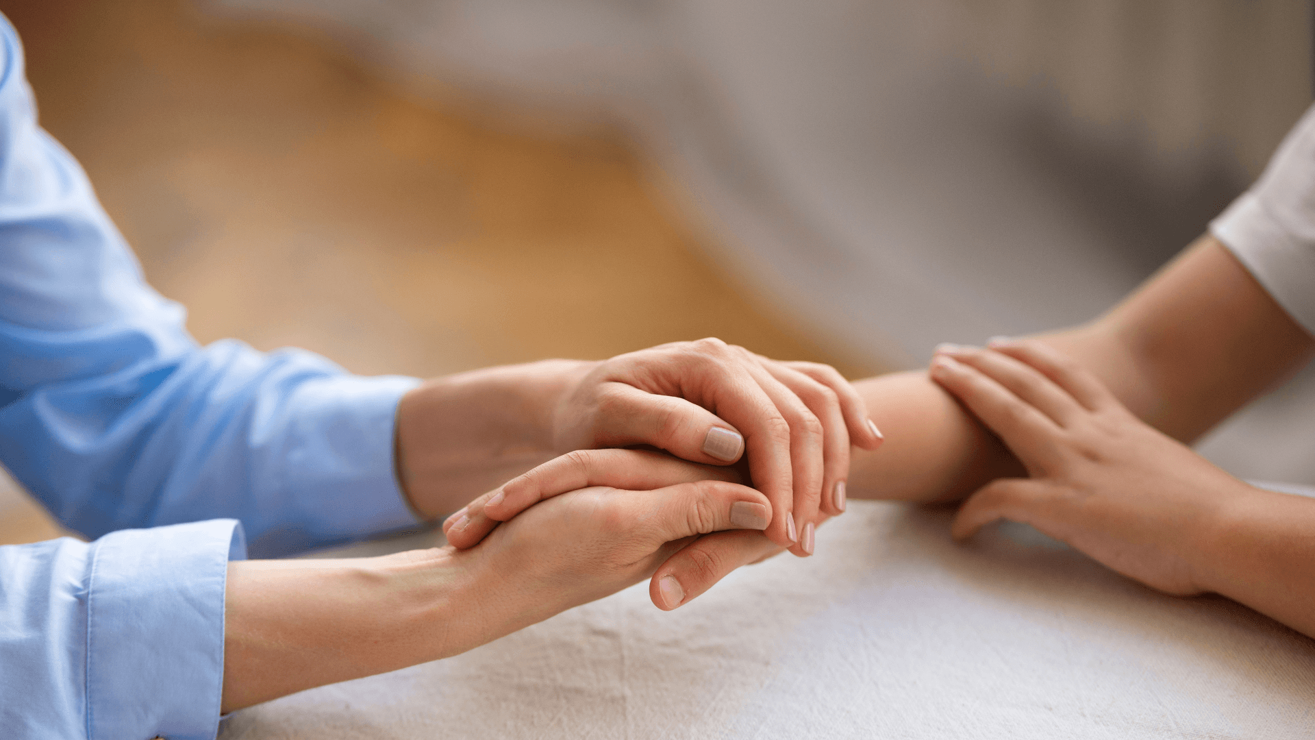 Hands offering calm and compassionate support