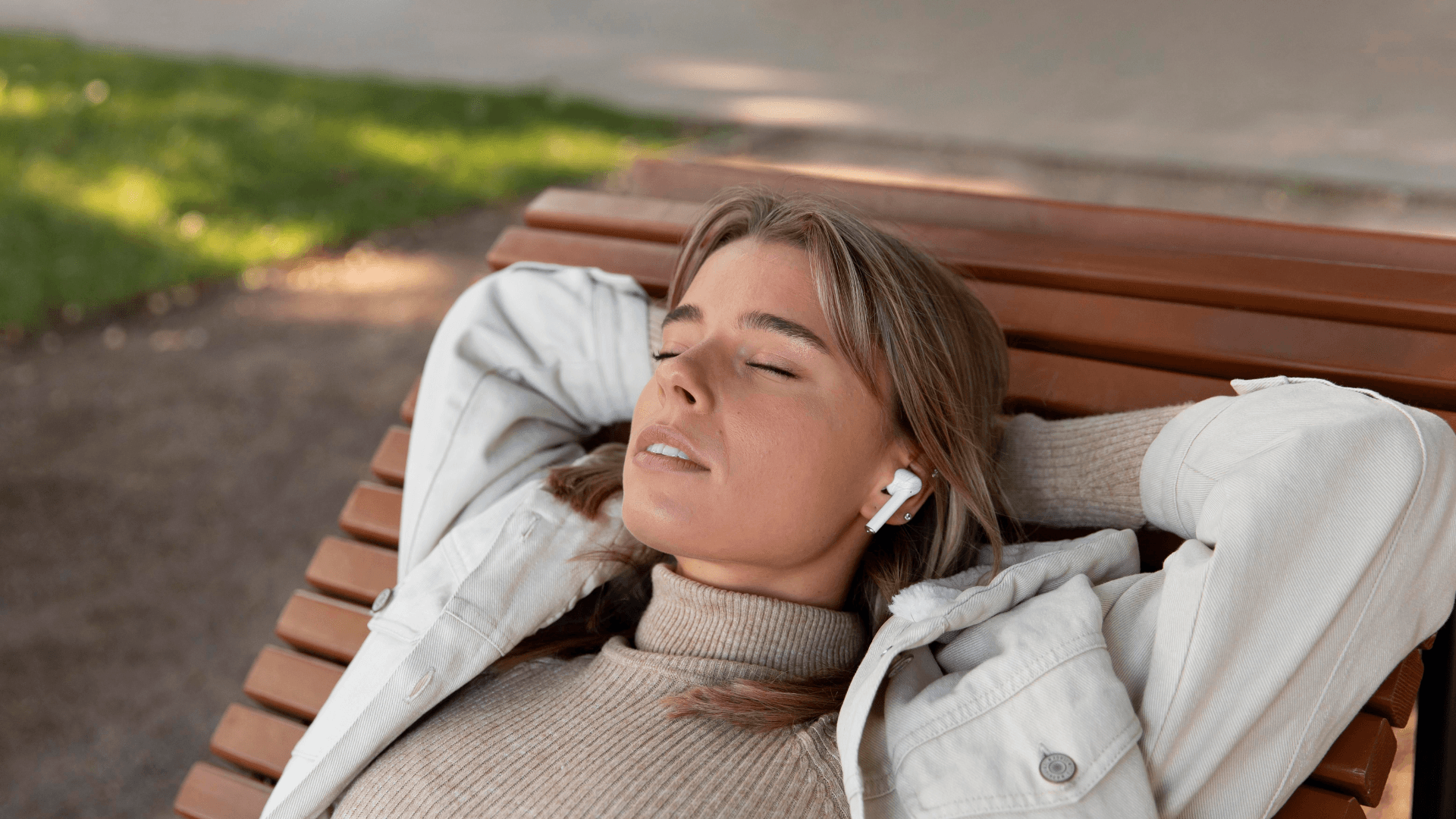 A woman resting peacefully outdoors